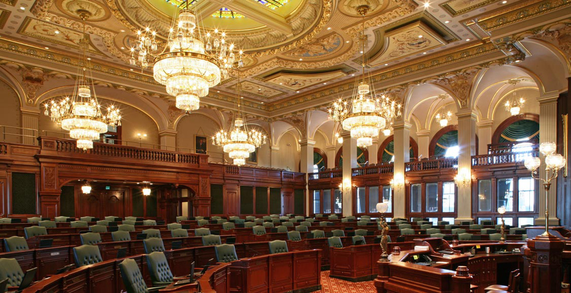 Evan Lloyd Architects provided government architectural services for the Illinois State Capitol in Springfield, Illinois. Renovation work for both chambers included construction of period-accurate chamber desks, restoration of original millwork, including speakers, podiums, press boxes, elaborate paneled doors and glazed side walls.