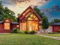 Evan Lloyd Architects provided residential architectural services, building a new, original, contemporary home for the Smith Residence in Cantrall, Illinois - the front of the house at twilight.